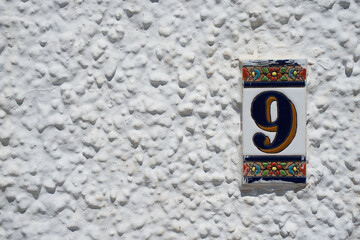 Number 9 on white background.