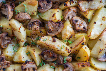 Baked potatoes with mushrooms in Dijon mustard sauce and olive oil
