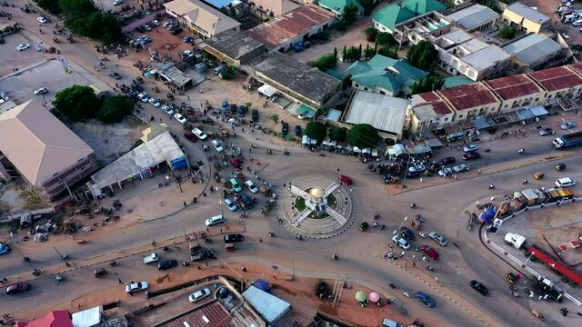 A busy roundabout with traffic congestion in central Katsina State of Nigeria - orbiting aerial view