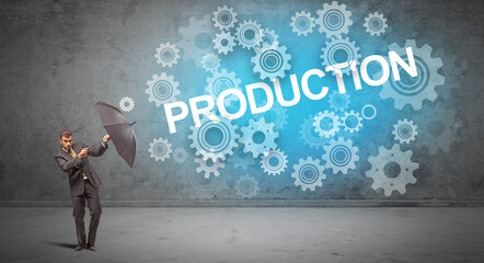 Obraz premium Businessman defending with umbrella concept