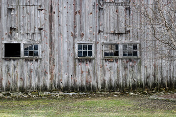 weathered wood barn wall and window