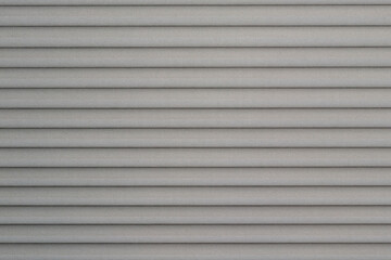 Grey pleated window blind close up with details. Home interior decoration