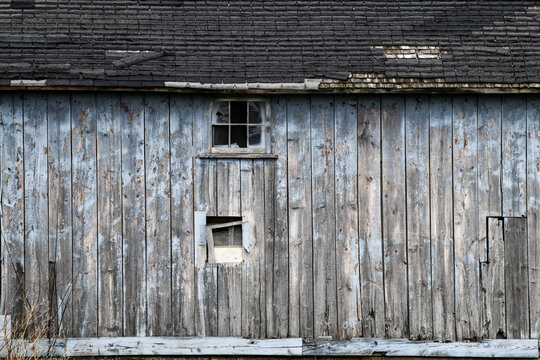 weathered wood barn wall and window
