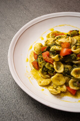 orecchiette alla pugliese, homemade Italian pasta. Orecchiette with turnip tops. detail