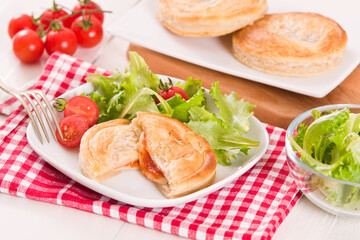 Puff pastry filled with tomato and mozzarella cheese.