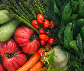 fresh and wet vegetables in the foreground. top view. mediterranean diet.