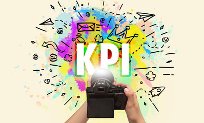 Close-up of a hand holding digital camera with abstract drawing