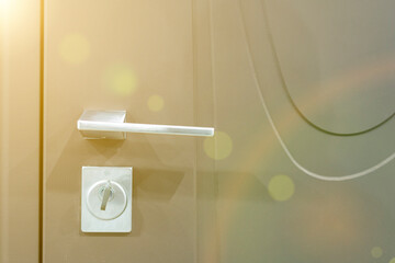Keys stuck in a lock. closeup Door lock keys, Real estate concept door handle, Key insert and hold...