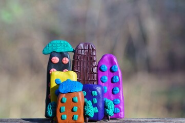 Naklejka premium A toy house made of plasticine. A symbol of well-being.