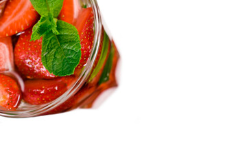 Summer fresh strawberry mojito cocktail or lemonade with mint leaves isolated on a white background.