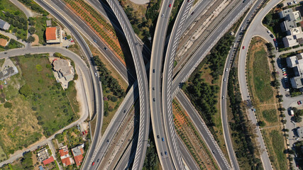 Aerial drone photo of multilevel highway intersection junction toll road outside city urban center