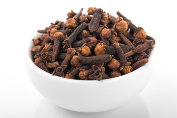 Clove, clove seed. Macro shot, Clove seed in white bowl,  on white background