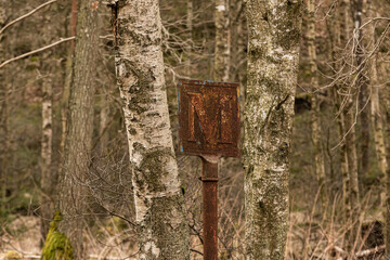 Old and rusty meeting point road sign.