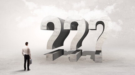 Rear view of a businessman standing in front of abbreviation concept