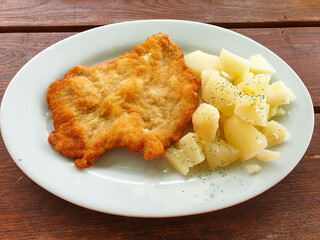 Polish kotlet schabowy (pork chop) with  potatoes