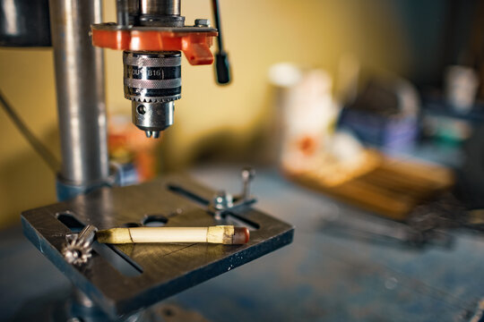 Drilling machine at the workplace of a toolman locksmith
