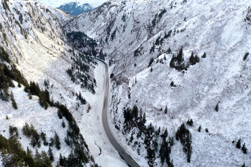 Aerial view of the Richardson Highway, Keystone Canyon, and Lowe River near Valdez, Alaska during the winter.