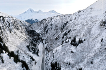 Aerial view of the Richardson Highway, Keystone Canyon, and Lowe River near Valdez, Alaska during the winter.