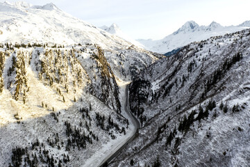 Aerial view of the Richardson Highway, Keystone Canyon, and Lowe River near Valdez, Alaska during the winter.