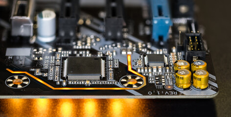 Printed circuit board on modern computer motherboard detail with electronic components. Micro...