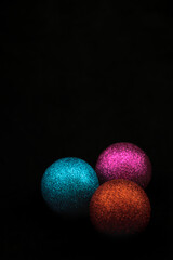 Christmas tree decorations on black background