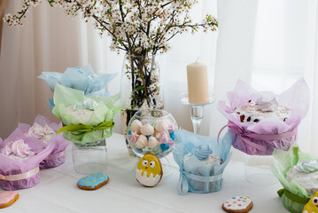 Beautiful Easter cakes on a decorated light table. A light holiday of Easter.
