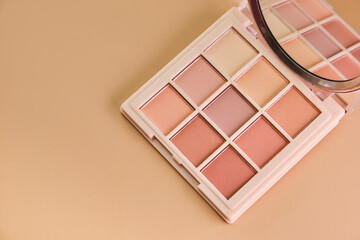 ye shadow palette swatches on pastel beige background