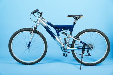 Fototapeta na wymiar studio shot of a mountain bicycle on blue background