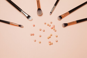 Various Cosmetic Brushes on Pink Background. Makeup Brushes Set for Take Care Skin.