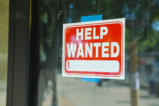 Help wanted sign in front of store