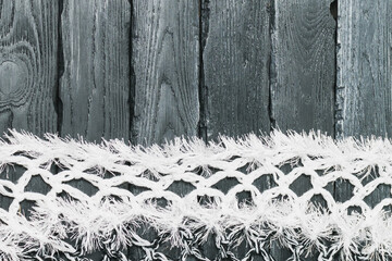 Knitted fabric with fringe on a decorative background