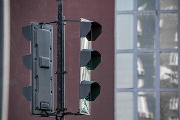 modern city traffic light regulates traffic green light