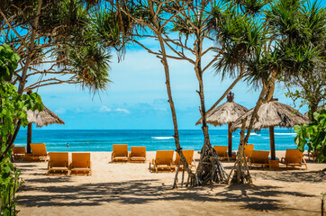 Beautiful seascape with cafe, decorative umbrellas and ocean, Bali, Indonesia