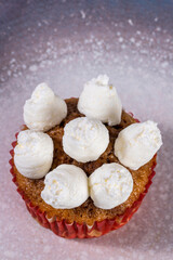 Cupcake with cream. Pastry and home cooking concept. Vertical photo and selective focus