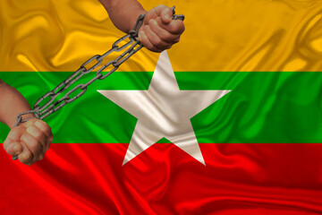 male hands break the iron chain, a symbol of tyranny, protest against the background of the...