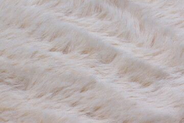 Light white long fiber soft fur. White fur for background or texture. Fuzzy white fur plaid. Shaggy...