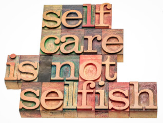 self care is not selfish  - isolated word abstract in vintage letterpress wood type, lifestyle and personal development