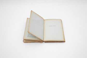 Antique open book isolated with flipping pages on white background