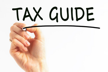 hand writing inscription tax guide with marker, concept, stock image