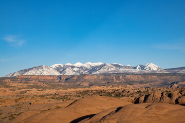 Distant mountains over rocky landscape.