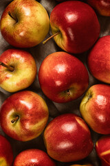 Fototapeta na wymiar Sweet fresh ripe red apple harvest background.