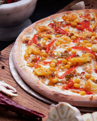 Delicious homemade pizza on a wooden background