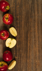 Fresh red apples  on the wooden table.Top view with copy space.Rustic food background.