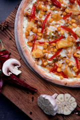 Delicious homemade pizza on a wooden background