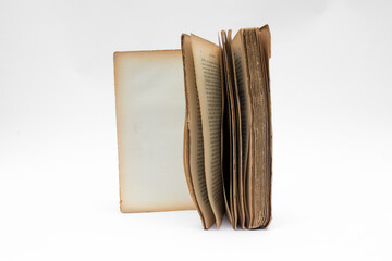 Antique open book isolated with flipping pages on white background