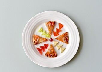 Fun kids food creatively arranged to entice healthy eating for children's meals. Photo concept, creative food, background, copy space