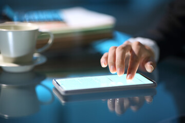 Businesswoman hand signing online on smart phone in the night