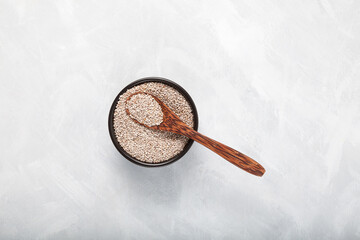 Peruvian seeds chia white in wooden spoon. Chia contains a large array of proteins, antioxidants, dietary fibers, vitamins and mineral key to healthy diet
