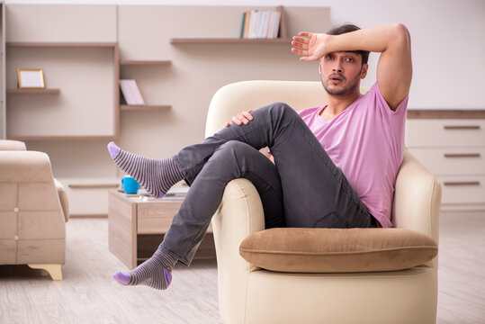 Young man siiting at home during pandemic