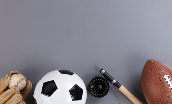 Fathers Day Concept With A Variety Of Sports Equipment On A Gray Background In Flat Lay View